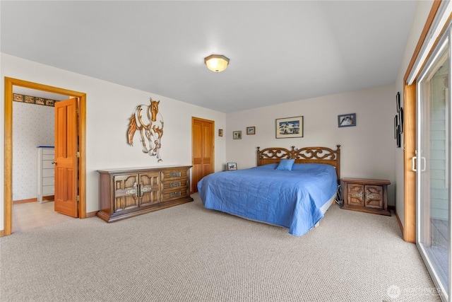 carpeted bedroom featuring baseboards