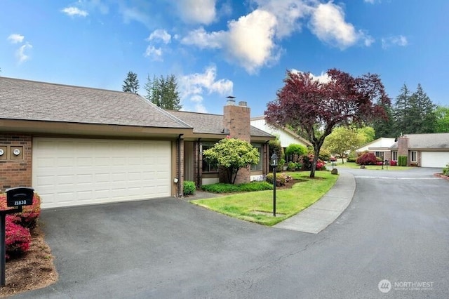 15930 NE 15th St, Bellevue, WA 98008 - ranch-style house featuring asphalt driveway, an attached garage, a chimney, and brick siding