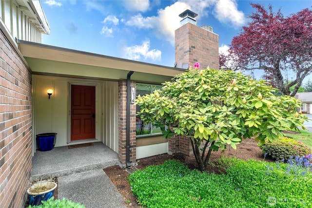 15930 NE 15th St, Bellevue, WA 98008 - doorway to property featuring brick siding and a chimney