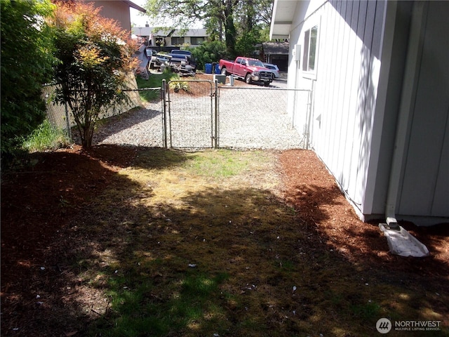 view of yard with a gate and fence