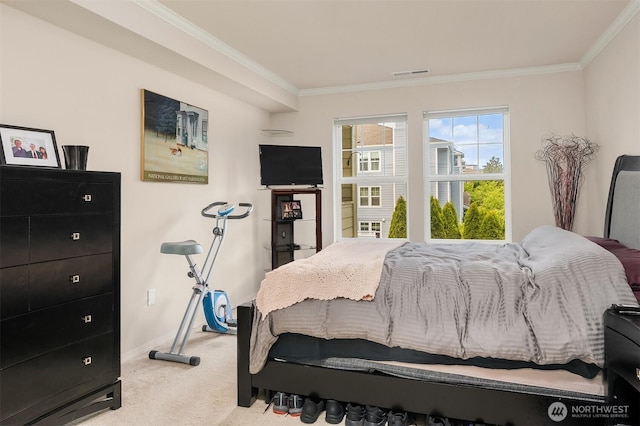 bedroom with carpet, ornamental molding, and baseboards