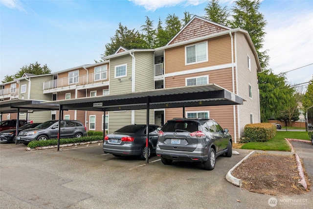 view of property featuring covered parking