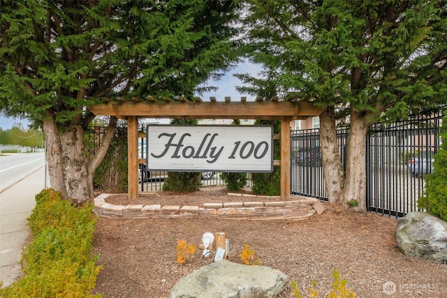 community sign featuring fence