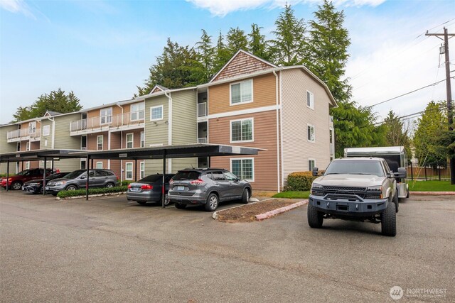view of property with covered parking