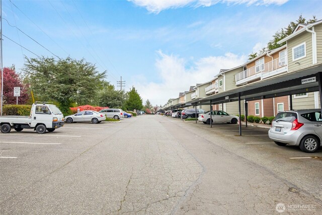 view of partially covered parking lot