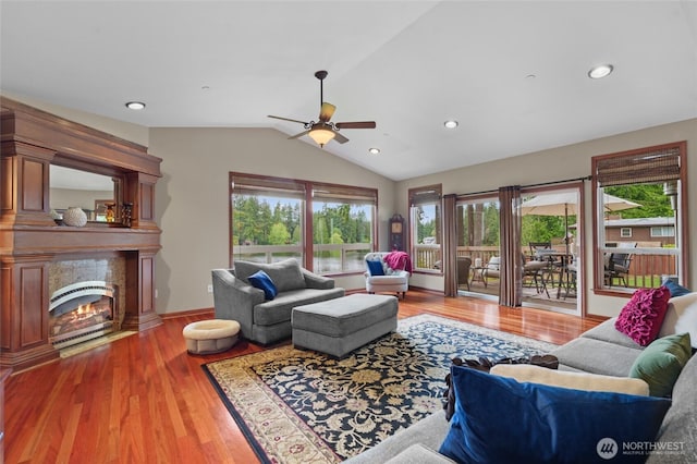35449 34th Ave S, Auburn, WA 98001 - living room with a ceiling fan, lofted ceiling, wood finished floors, a lit fireplace, and recessed lighting