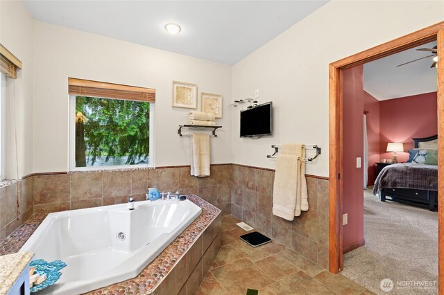 35449 34th Ave S, Auburn, WA 98001 - full bath featuring a tub with jets, connected bathroom, tile walls, and wainscoting
