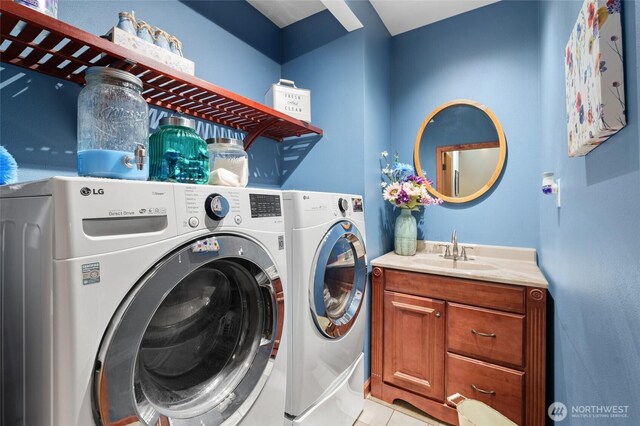 35449 34th Ave S, Auburn, WA 98001 - washroom with washer and dryer, light tile patterned floors, and cabinet space