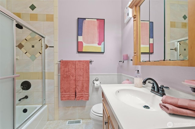 35449 34th Ave S, Auburn, WA 98001 - full bath featuring vanity, toilet, combined bath / shower with glass door, and wainscoting
