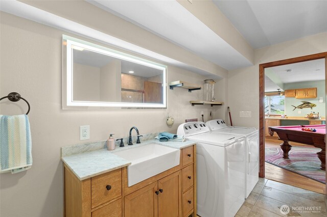 35449 34th Ave S, Auburn, WA 98001 - laundry area featuring separate washer and dryer, cabinet space, pool table, and light tile patterned floors