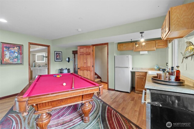 35449 34th Ave S, Auburn, WA 98001 - playroom featuring a sink, light wood-style flooring, pool table, and baseboards