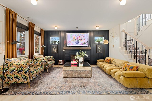 living room featuring stairs and wood finished floors
