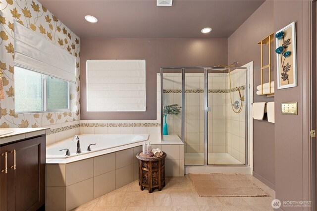 full bathroom featuring a stall shower, a garden tub, tile patterned flooring, vanity, and recessed lighting