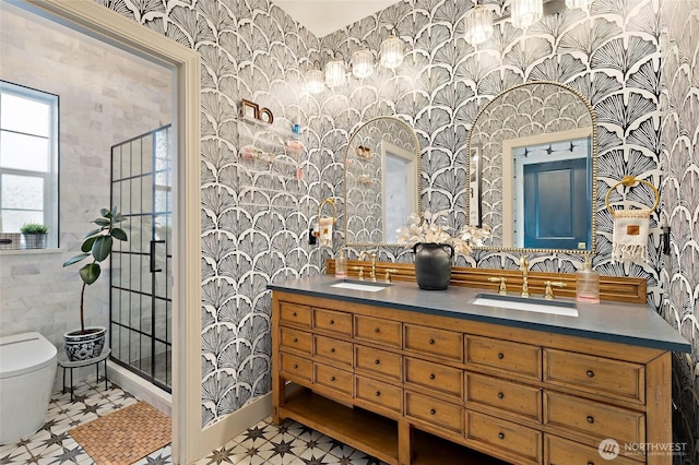 bathroom with wallpapered walls, toilet, tile patterned floors, a stall shower, and double vanity