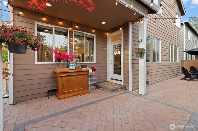 doorway to property with a patio