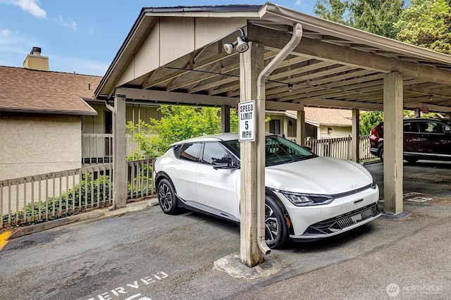 covered parking lot with fence
