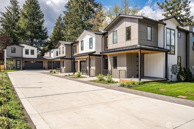 1831 4th St Unit A, Kirkland, WA 98033 - view of front facade featuring a standing seam roof, concrete driveway, an attached garage, and metal roof