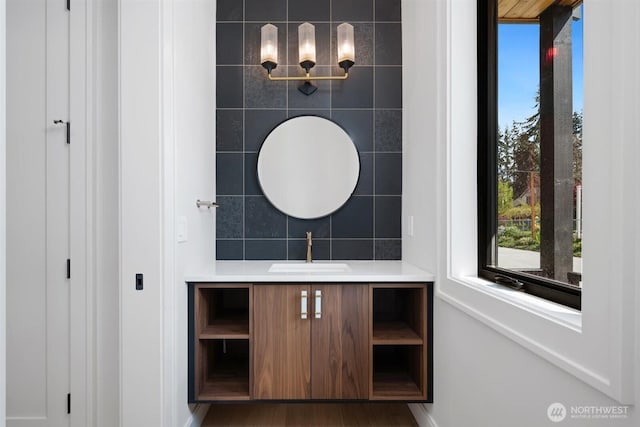 1831 4th St Unit A, Kirkland, WA 98033 - bathroom featuring vanity, baseboards, and wood finished floors