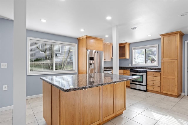 1526 192nd St SE Unit P4, Bothell, WA 98012 - kitchen with stainless steel appliances, a center island, dark stone counters, baseboards, and recessed lighting