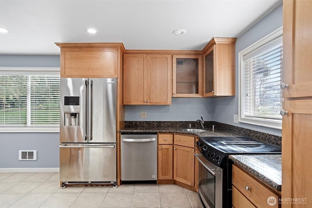 1526 192nd St SE Unit P4, Bothell, WA 98012 - kitchen featuring appliances with stainless steel finishes, a sink, glass insert cabinets, dark stone countertops, and recessed lighting