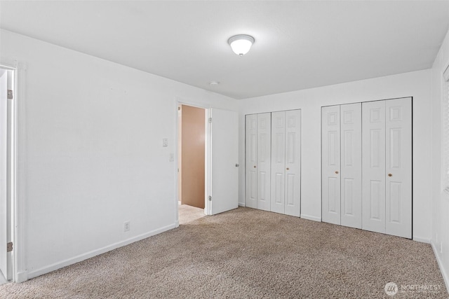 1526 192nd St SE Unit P4, Bothell, WA 98012 - unfurnished bedroom with multiple closets, carpet, and baseboards