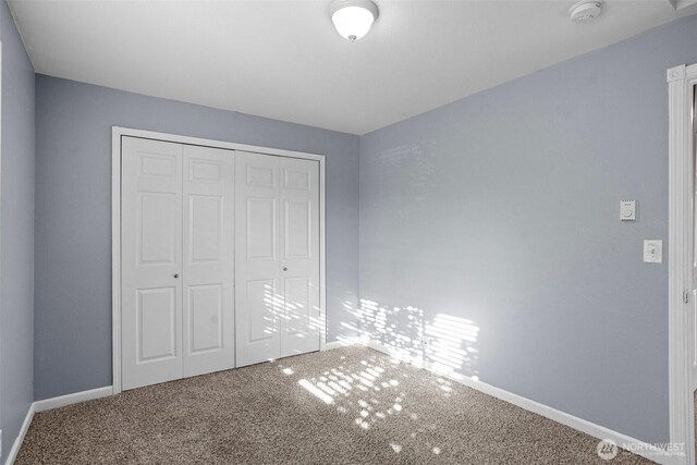 1526 192nd St SE Unit P4, Bothell, WA 98012 - unfurnished bedroom with carpet flooring, baseboards, and a closet