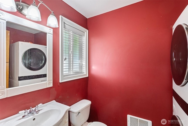1526 192nd St SE Unit P4, Bothell, WA 98012 - half bath with a sink, stacked washer / dryer, toilet, and heating unit