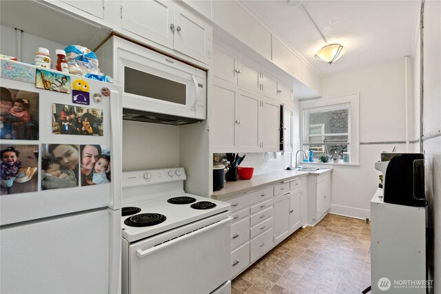 1905 W 2nd St, Spokane, WA 99201 - kitchen featuring white appliances, white cabinetry, and light countertops
