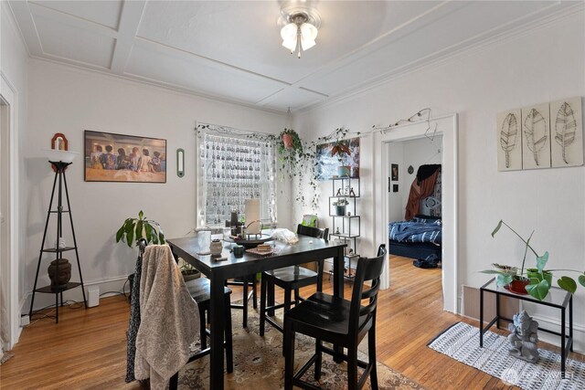 1905 W 2nd St, Spokane, WA 99201 - dining area with light wood finished floors, coffered ceiling, and ornamental molding