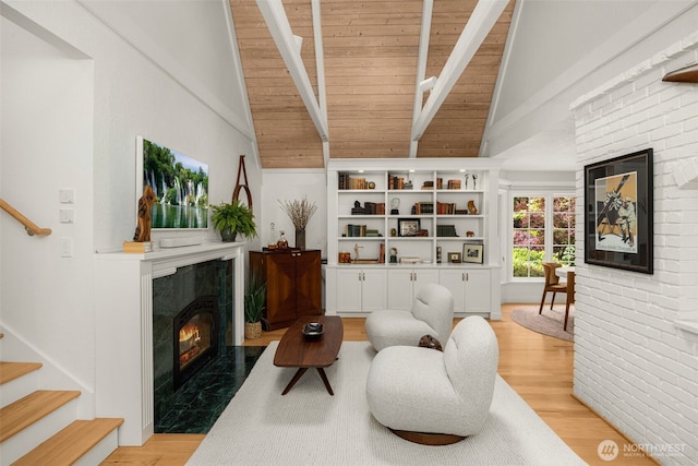 5222 W Mercer Way, Mercer Island, WA 98040 - sitting room with a fireplace, high vaulted ceiling, stairway, light wood finished floors, and beamed ceiling