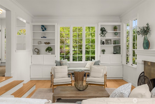 5222 W Mercer Way, Mercer Island, WA 98040 - living room featuring plenty of natural light, light wood finished floors, ornamental molding, and baseboards