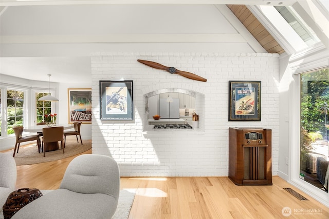 5222 W Mercer Way, Mercer Island, WA 98040 - living area featuring light wood-style floors and brick wall