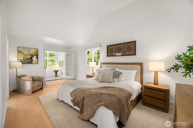 5222 W Mercer Way, Mercer Island, WA 98040 - bedroom featuring wood finished floors, high vaulted ceiling, and baseboards
