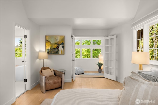 5222 W Mercer Way, Mercer Island, WA 98040 - living area with wood finished floors, baseboards, and french doors