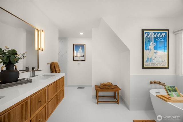 5222 W Mercer Way, Mercer Island, WA 98040 - bathroom with a freestanding bath, double vanity, and recessed lighting