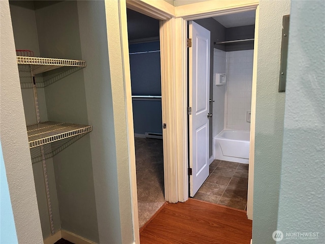 closet with a baseboard radiator