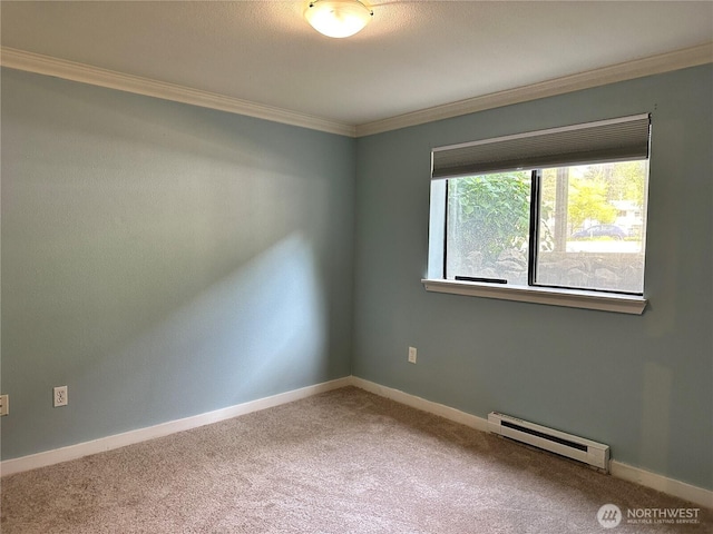 unfurnished room featuring a baseboard heating unit, ornamental molding, carpet, and baseboards