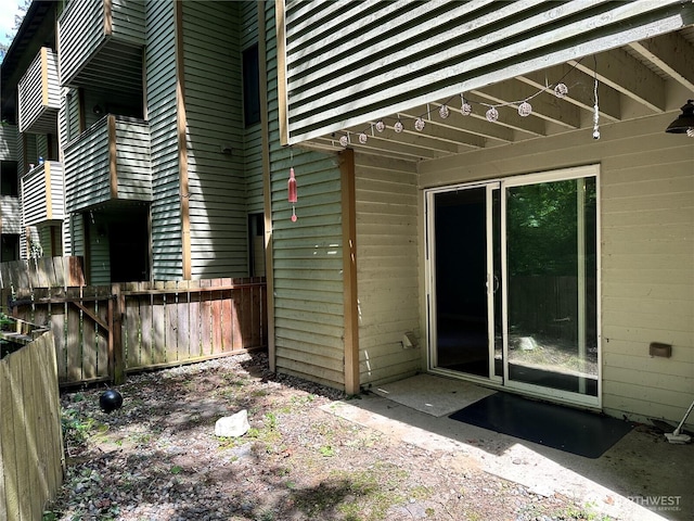 doorway to property with fence