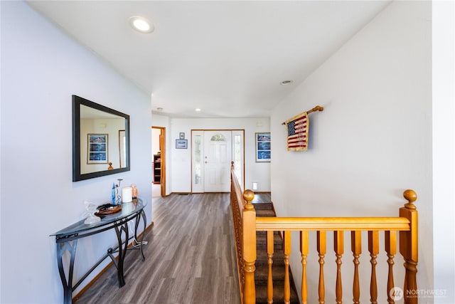hallway featuring wood finished floors, recessed lighting, and baseboards