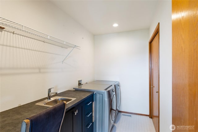 washroom with independent washer and dryer, cabinet space, recessed lighting, bar with sink, and baseboards