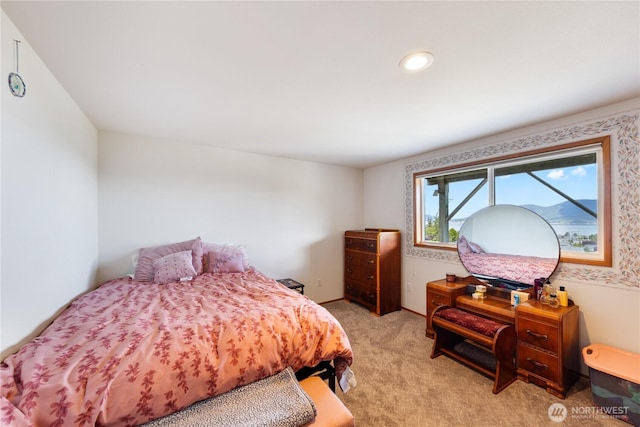 bedroom featuring light colored carpet