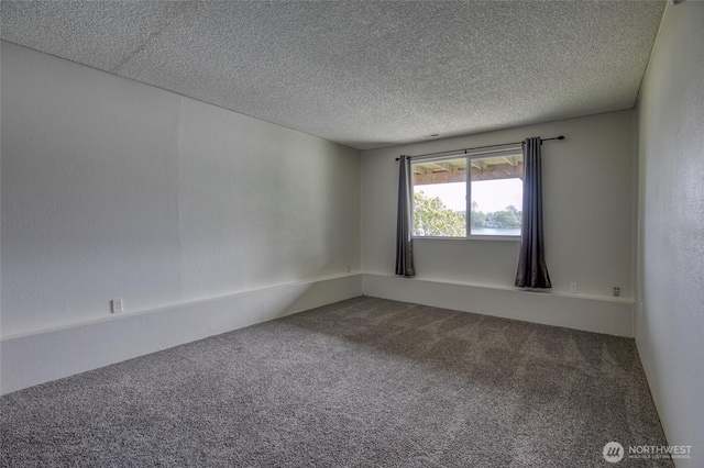 712 Mt Olympus Ave SE, Ocean Shores, WA 98569 - spare room with carpet and a textured ceiling