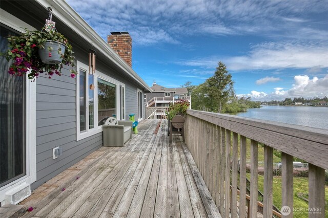 712 Mt Olympus Ave SE, Ocean Shores, WA 98569 - wooden terrace with a water view