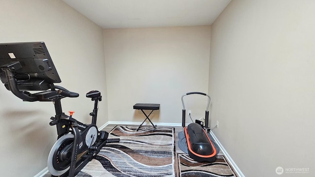exercise room with baseboards