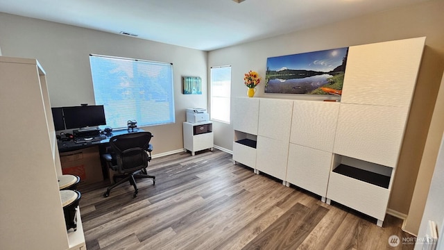 office featuring wood finished floors and baseboards