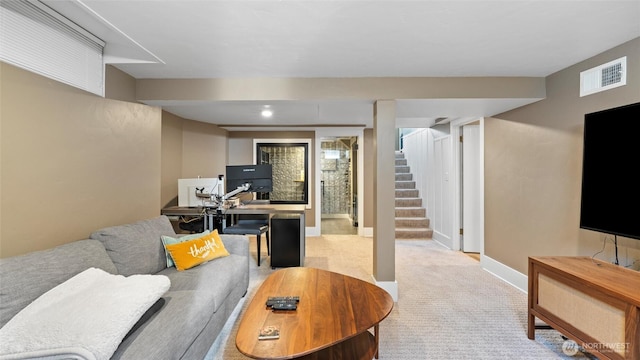 carpeted living room with stairs and baseboards