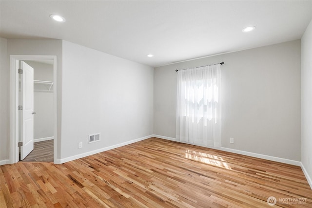 78 Whitten St, Richland, WA 99354 - unfurnished bedroom featuring light wood-type flooring, baseboards, recessed lighting, a spacious closet, and a closet