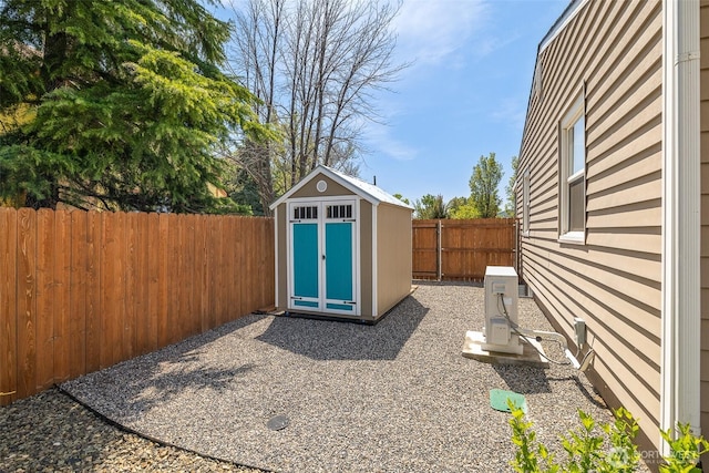 78 Whitten St, Richland, WA 99354 - view of shed featuring a fenced backyard and a cooling unit