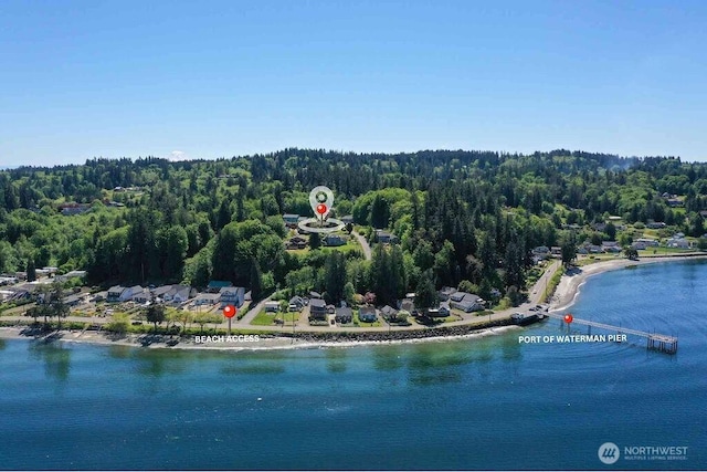 aerial view of a heavily wooded area and a large body of water