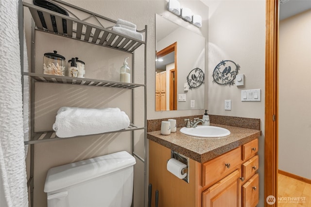 436 E Pointes Dr E, Shelton, WA 98584 - bathroom featuring toilet, wood finished floors, and vanity